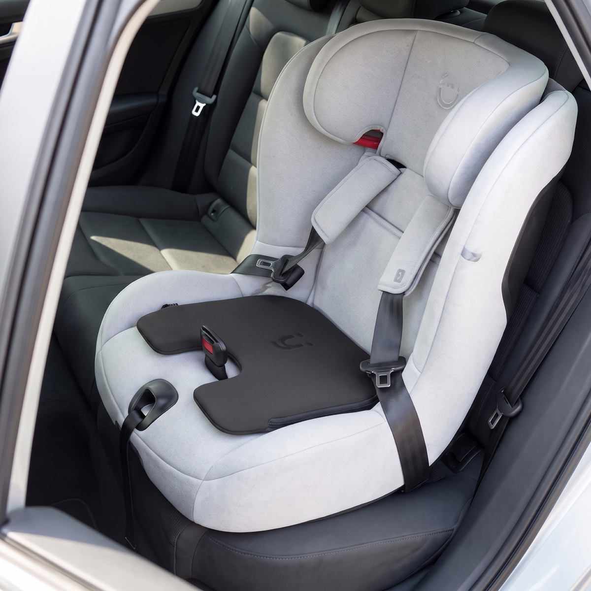 The Babi Seat cushion fitted on the seat pad of a child car seat